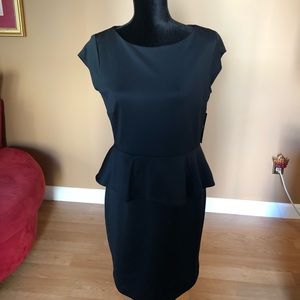 Black Peplum dress new with tags. Size medium.